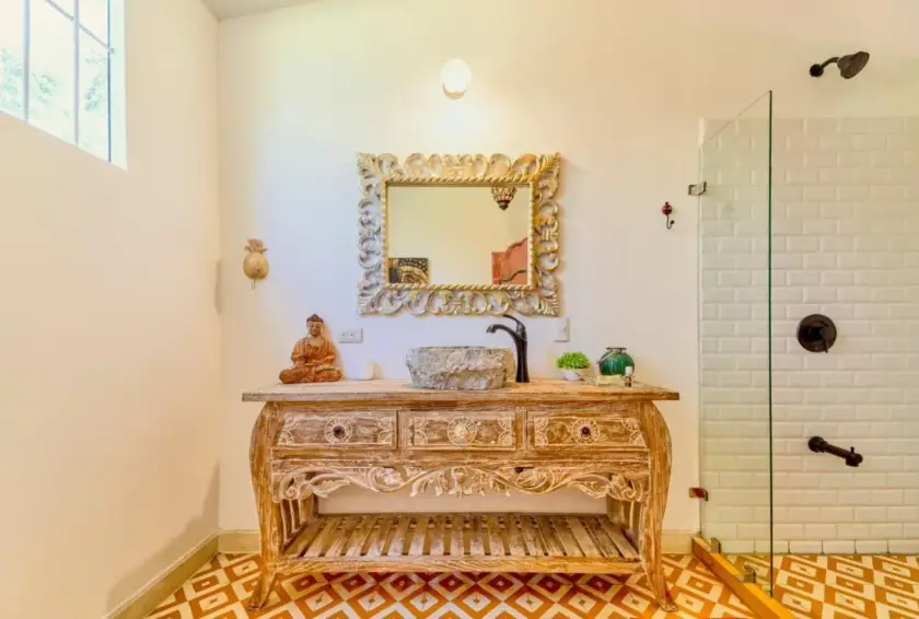 Handcrafted bathroom vanity and walk-in shower inside the private Bali-inspired retreat villa in Playa Chiquita