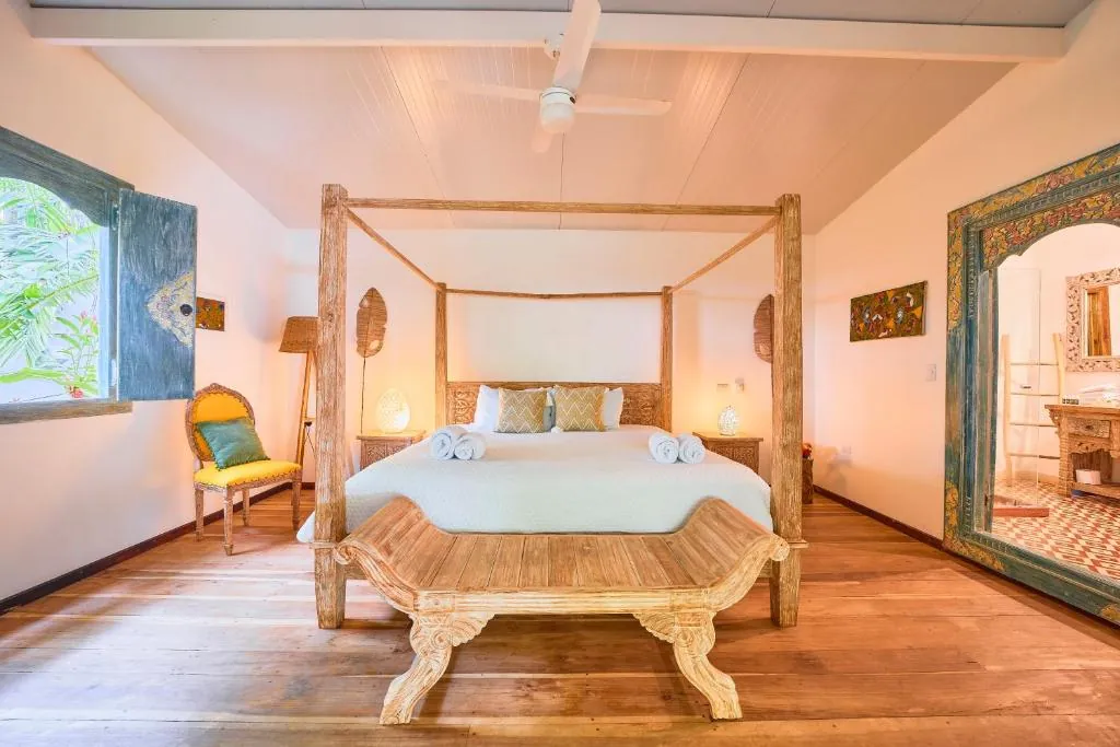 King bed in a private Bali-inspired retreat villa in Playa Chiquita, Costa Rica