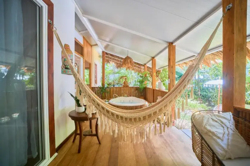 Hammock on the covered terrace of a private jungle villa in Playa Chiquita, Costa Rica