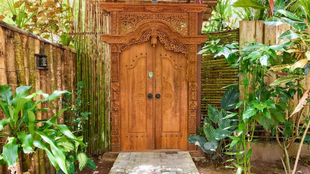 Jungle entrance gate to the private Bali-inspired villa accommodation in Playa Chiquita