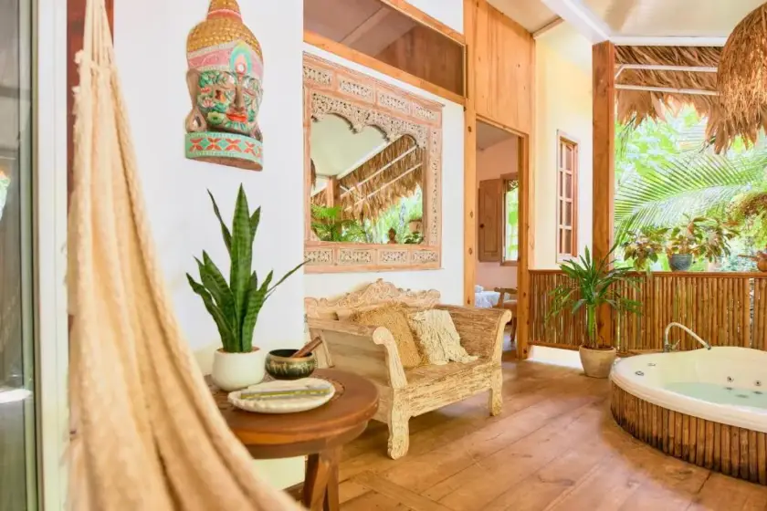 Open-air villa lounge with private jacuzzi in Playa Chiquita, Costa Rica