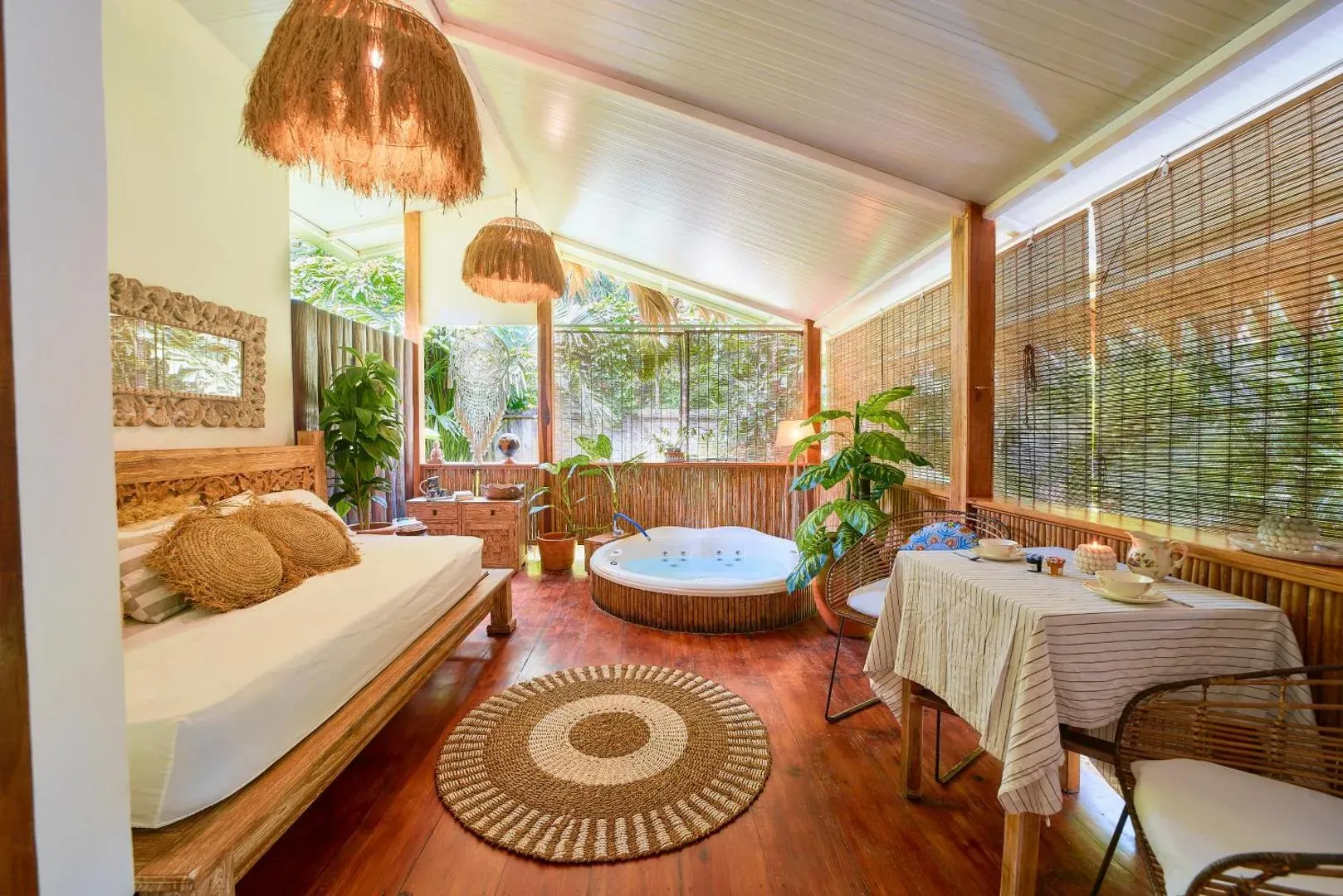 Private Bali-inspired jungle villa outdoor living area with jacuzzi in Playa Chiquita, Costa Rica